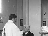 Fr Willie Spicer - First mass - Lyons0003441.jpg  Fr Willie Spicer giving communion to his dad. : Spicer