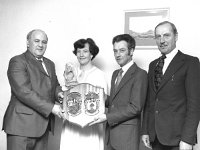 Presentation to Nicki Lambert - Lyons0004209.jpg  At presentation function in Hotel Westport to mark the retirement from the Army of Quarter Master Sgt. Nicholas Lambert, Westport Comdt. Michael Considine (left) 5th Motor Squadron, Castlebar presents an engraved crystal decanter to Mrs Maureen Lambert and a combined 5th Motor Squadron Crest and the Lambert family Crest on behalf of the 5th Motor Squadron, Castlebar. : Considine, Lambert