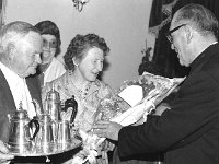 Presentation for retiring postman - Lyons0005149.jpg  Presentation in O' Connors Arms Ballindine to retiring postman. Monsignor John Colleran making a presentation to the retiring postman and his wife. : Ballindine, Colleran, Postman