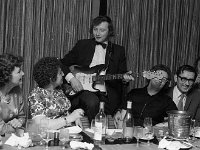 Reception in Jury's Hotel for British Journalists , 1973. - Lyons0007638.jpg  Frankie Chamber's son Tony entertaining the guests - singing and playing the guitar. Reception in Jury's Hotel for British Journalists , 1973. : 19730310 Reception in Jury's Hotel for British Journalists 1.tif, Functions 1973, Lyons collection