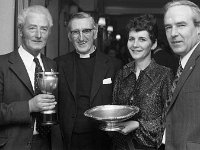 - Lyons0007944.jpg  L-R : John Moran; Rev Mc Ginley Rector Holy Trinity, Westport; Frances Moran and Colm Feeney. : 1974 Functions, 19741115 Westport IFA Dinner Dance in Central Hotel 2.tif, Lyons collection