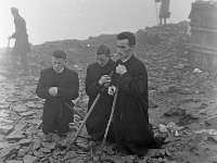 Pilgrimage Day on Croagh Patrick, 1972. - Lyons00-21017.jpg  Three priests in prayer on Croagh Patrick. : 197207 Pilgrimage Day on Croagh Patrick 23.tif, Lyons collection, Order of Malta
