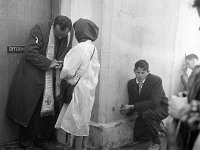 Pilgrimage Day on Croagh Patrick, 1972. - Lyons00-21024.jpg  Young boy kneels while he waits for confession. : 197207 Pilgrimage Day on Croagh Patrick 3.tif, Lyons collection, Order of Malta