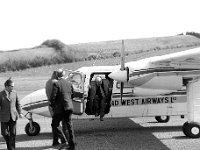 Irish Press Photo 1973 - Lyons00-21477.jpg  Evening Press columnist Terry O' Sullivan arrives at Castlebar Airport. At left Jim Ryan Managing Director Castlebar Airport. Stories around Ballina with Terry O' Sullivan Evening Press. : 19730407 Terry O' Sullivan page 5.tif, Irish Press, Lyons collection