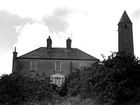 Irish Times photo, 1980. - Lyons00-21569.jpg  Church of Ireland residence of the Rector Dean Ashton also showing the Killalla Round Tower which is maintained in excellent condition. : 19800903 Residence of Rector Dean Ashton.tif, Irish Times, Lyons collection