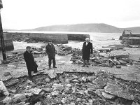 Irish Times photo, 1991. - Lyons00-21629.jpg  Mayo County Councillors visiting Purteen harbour Achill to view the storm damage of the previous night the 7th of January. : 19910108 Purteen pier 5.tif, Irish Times, Lyons collection