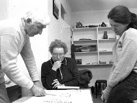 Irish Times photo, 1991. - Lyons00-21631.jpg  A feature in the Irish Times by journalist Victoria White on the painting school in Pontoon Bridge Hotel, Co. Mayo. At left is retired Garda Sergeant Pat Goff an established artist and art teacher looking over the plans for the Summer programme. : 19910502 Painting School 1.tif, Irish Times, Lyons collection